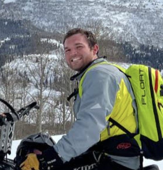 Brett Bundy on a snowmobile